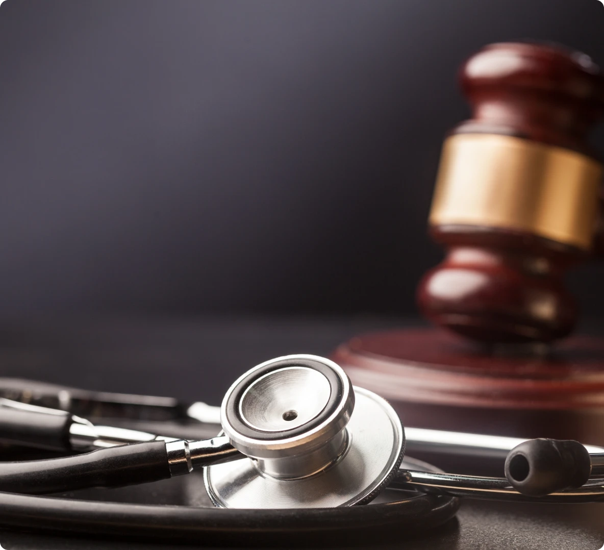 Stethoscope and gavel on a table