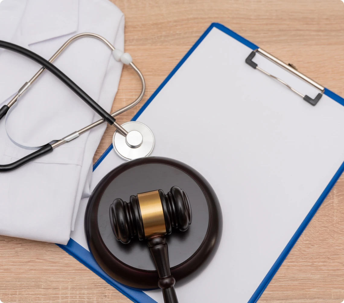 Doctor's coat with gavel and clipboard