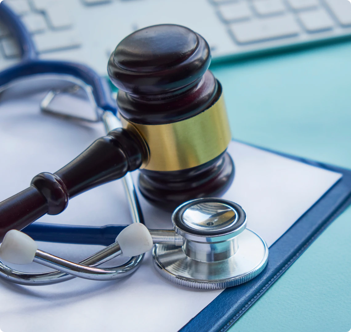 Gavel and stethoscope on documents
