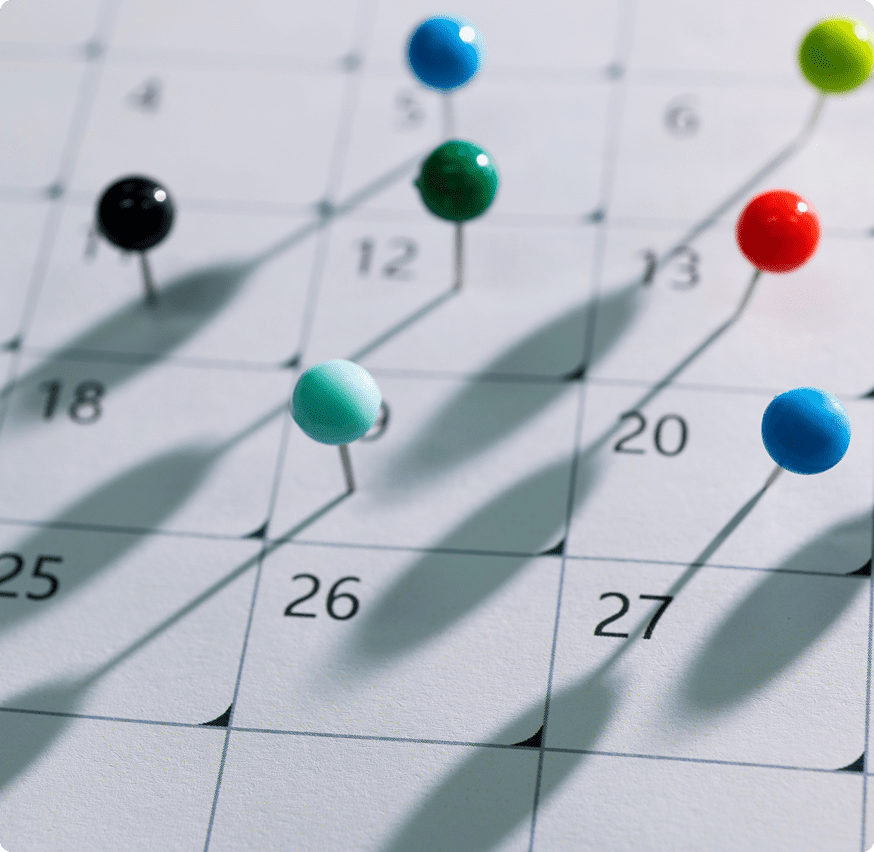 Colorful pins on calendar dates