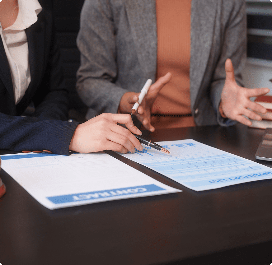 Colleagues analyzing paperwork at table